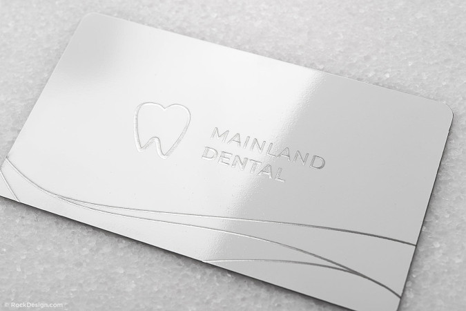 Beautiful bright white dentist business card template – Mainland Dental