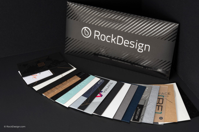 High-end custom business card samples from RockDesign showcasing premium printing finishes and unique card materials.