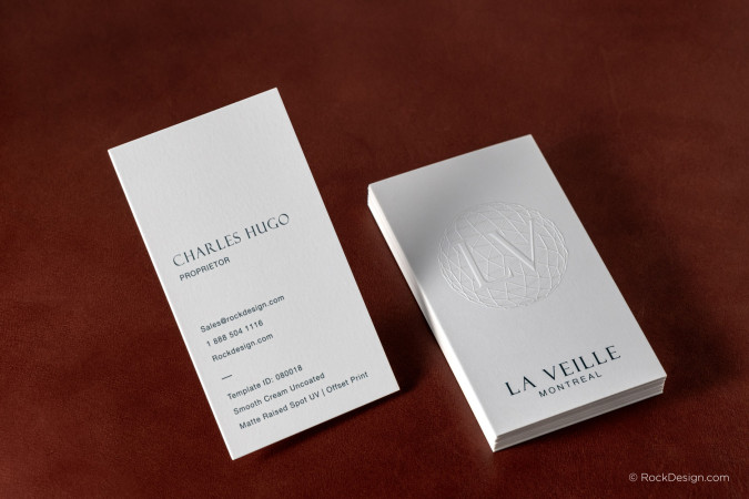 Luxury cream uncoated business cards with matte raised spot UV logo and minimalist typography