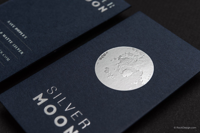Luxury duplex business card in navy with silver foil details for premium branding
