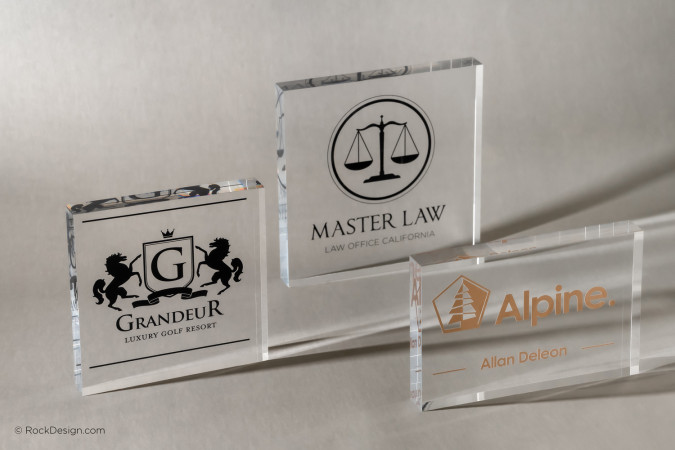 Custom UV printed clear acrylic blocks featuring Master Law, Grandeur, and Alpine logos by RockDesign.