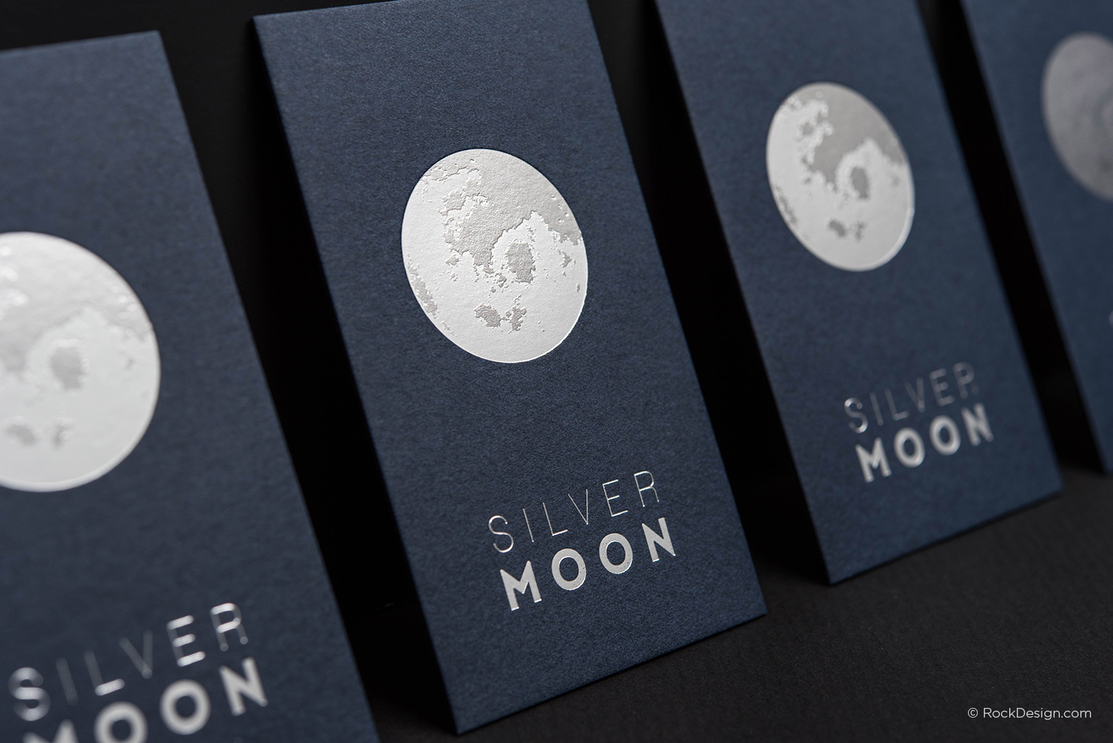 Duplex navy blue business card with silver foil stamping on 26pt cardstock