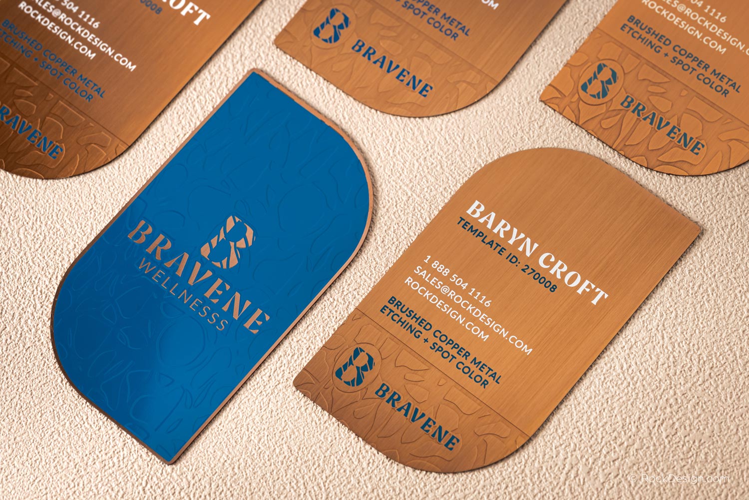 Custom brushed copper metal business cards with blue spot color and etched pattern — luxury die-cut design by RockDesign for Bravene Wellness.