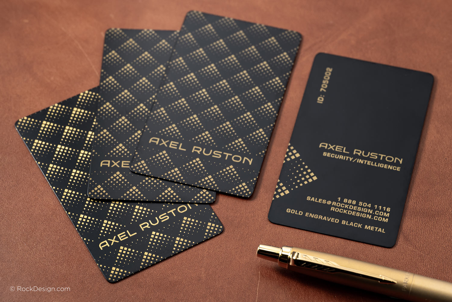 Gold engraved black metal business cards with geometric pattern, laser engraved logo and text, luxury custom metal cards by RockDesign.