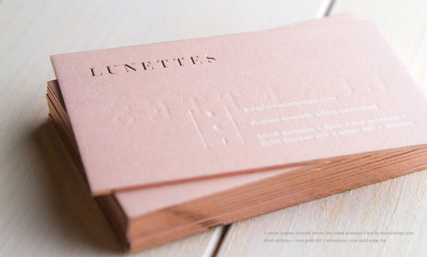 Luxury blush pink business cards with rose gold foil stamping, blind embossing, letterpress printing, and rose gold edge foil on thick duplex cardstock.